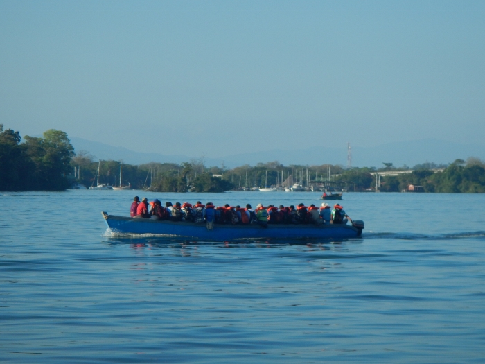 2016 Local workers travel by ferry to their jobs on the Rio
      Dulce