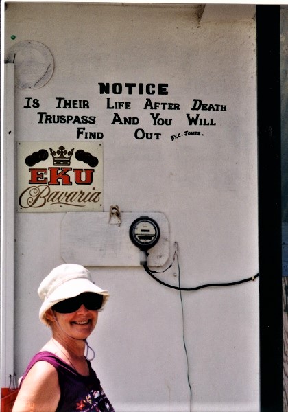 2002 Union Island Grenadines Kathy poses in front of sign