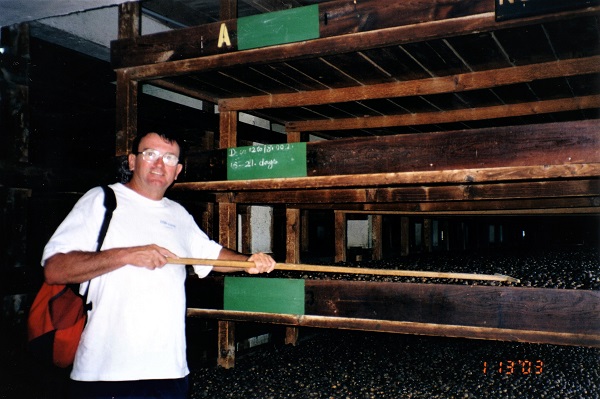 2003 Grenada Brian rakes some nutmeg at the factory