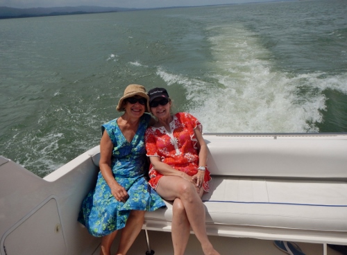 Kathy and Dori enjoy the sunday
        afternoon ride down the Rio on the power boat THE COFFEE BEAN