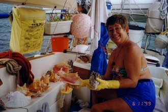 Kathy examines Conch that we dined on in Pipe Creek Bahammas 1998