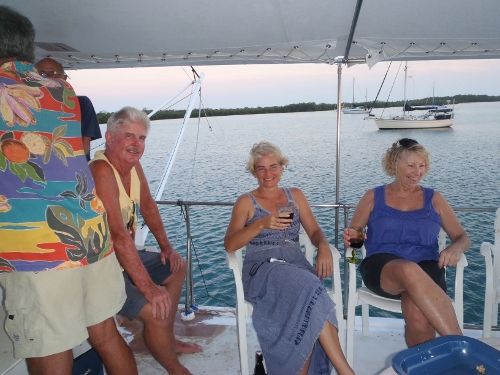 Sundowners on the
                Power Boat Cabaret in Sapodilla Lagoon