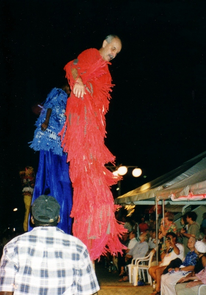 Bernie W3G afellow Yachties demonstates
          his skill on stilts at Carnival Orientation