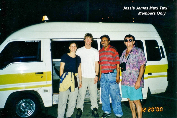 Jessie poses with us and his Taxi Members Only in
          Trinidad