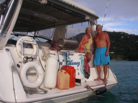 Heather and Jerry aboard their boat NUT N HONEY in
            Bequia 2005