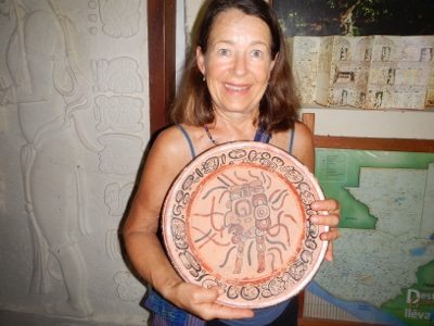 Kathy has a rare opportunity to hold a dish used
          by the Mayans in the year 200BC