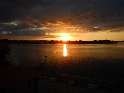 Sun sets over the lake as we viewed
        it from Hotei Santana