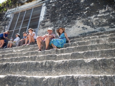 We relax
        after a long climb to near the top on Temple Four the highest
        Monument in Tikal