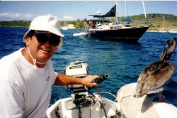 Brian cruises the anchorage with his pelican crew at Los
        Testigos