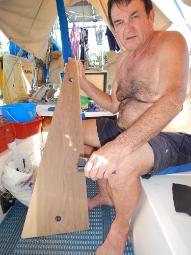 Brian shows off
        the new head floorboard made by Carlos the Carpenter