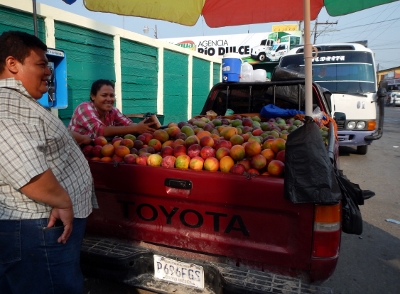 A local farmer sells his wares in
        downtown Rio Dulce