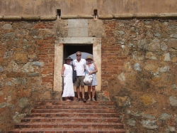 Joan,Carlos and Kathy
          pose at entrance to the Fort on Margarita Island Venezuela