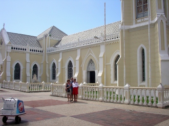 Carlos with Milton and
        Nadine outside a famous cathedral on Margarita Island in
        Venezuela