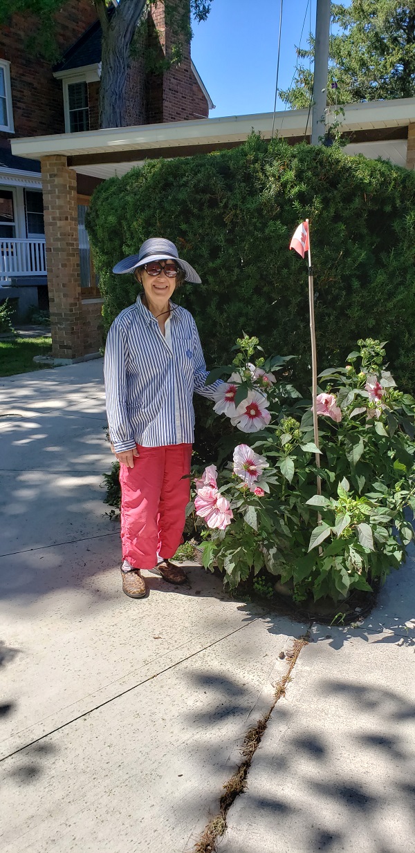 2002 Kathy at the Antennae Garden by her Hbiscus Flower
