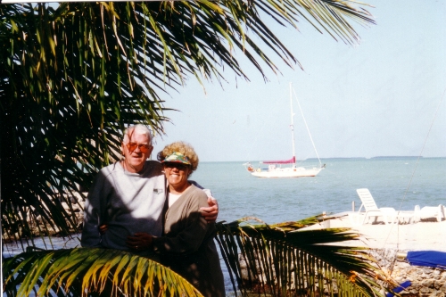 Kelly and Karen on Isla Morada in the Abacos with
          Tundra anchored in the back ground