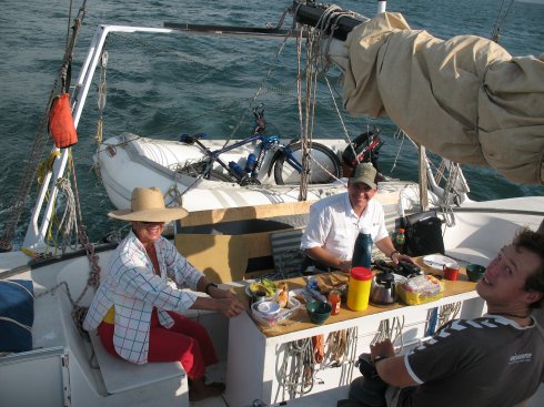 Kathy relaxes with our canal advisor in the cockpit