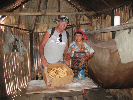 Brian buys bread from the Bread Lady in the village