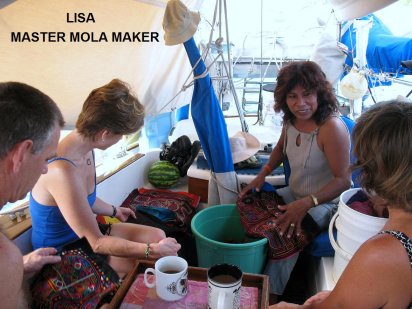 Sue negotiates a
        mola puchase with Lisa a master mola maker