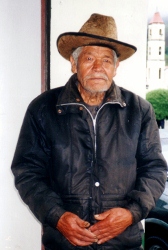 An elder mountain
        man poses for us high up in the Andes