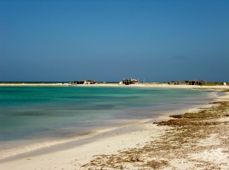 Fishing Huts located on Playa Caldera at
          the Venezuelan Island of Tortuga